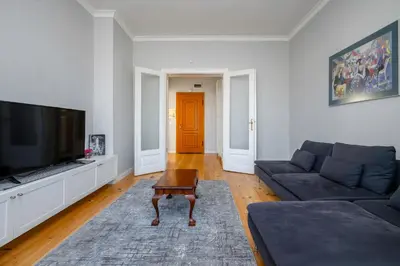 a living room with a couch and a tv at Charming 1BD Apartment Next to Women's Market by Flat Mаnager in Sofia