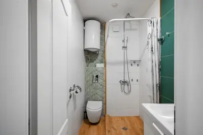a bathroom with a toilet and a shower at Charming 1BD Apartment Next to Women's Market by Flat Mаnager in Sofia