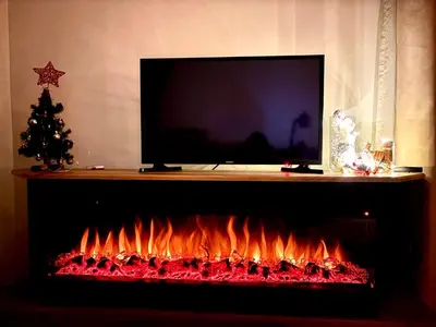 a fireplace with a tv on top of it at Alpine Charm Borovets Apart in Borovets