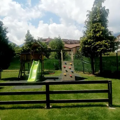 a playground with a slide in a park at Bansko Royal Towers apartment Star in Bansko