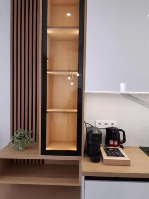 a kitchen with a cupboard with a stove and a kitchen at Villa Vitosha Apartments in Hisarya