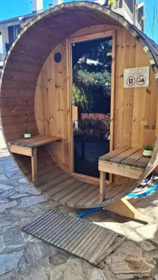 a wooden building with a bench in front of it at Silver Ridge Studio by SI Stay in Razlog