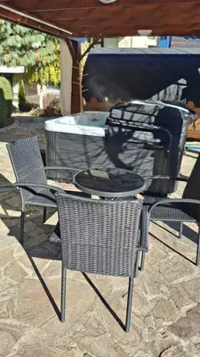 an outdoor table and chairs with a grill and a fire pit at Silver Ridge Studio by SI Stay in Razlog