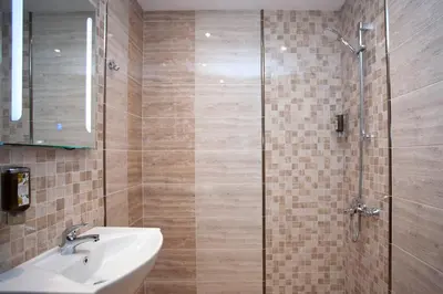 a bathroom with a sink and a shower at Mon Ami Apart in Studentski Grad Area in Sofia