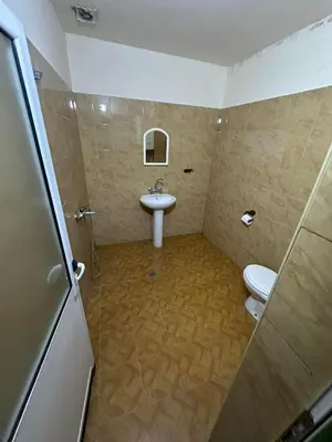 a bathroom with a sink and a toilet at Хотел Елит in Kostinbrod
