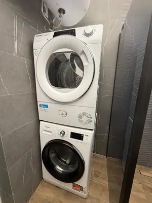 a washing machine and a washer in a bathroom at Downtown Gem in Plovdiv