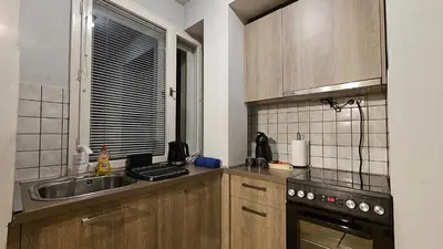 a small kitchen with a sink and a stove at Colorful 2BD Apartment next to Serdika Center by Flat Mаnager in Sofia
