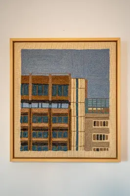 a painting of some buildings on a wall at A central retreat in the heart of Sofia in Sofia