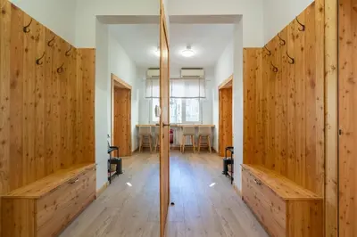 a large room with wooden walls and wooden floors at A central retreat in the heart of Sofia in Sofia