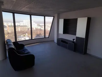 a living room with a couch and a flat screen tv at ApartBelisimo4 in Sofia