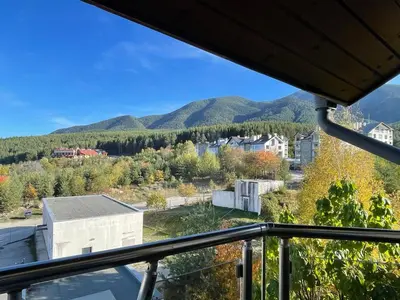 a view of the mountains from a balcony at Bansko soul relax place in Bansko