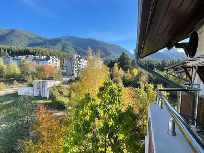 a view of the mountains from a balcony at Bansko soul relax place in Bansko
