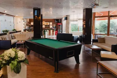 a living room with a pool table in it at Rila Residence - next to Pirin Golf in Razlog