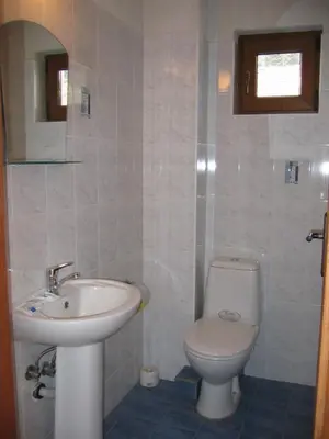 a bathroom with a sink and a toilet at Villa Leventy in Banya