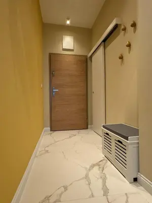 a room with a door and a marble floor at Homely Apartment in Lozenets Sofia in Sofia