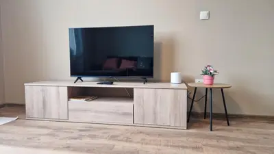 a entertainment center with a large television on top of it at Cosy n fully equipped studio in Samokov