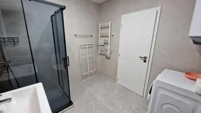 a bathroom with a shower and a toilet and a sink at Cosy n fully equipped studio in Samokov