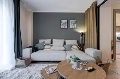 a living room with a couch and a table at Veslets 4 Oldtown Stay in Sofia