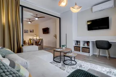 a living room with a couch and a table at Veslets 4 Oldtown Stay in Sofia