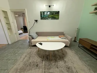 a living room with a couch and a coffee table at Florence family 2BDR Apt - min from Serdika w WiFi in Sofia