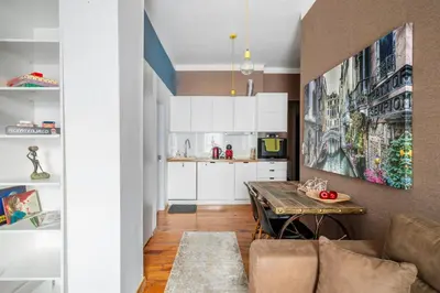 a living room with a couch and a table at Cozy and Central 2BD Flat - At the Heart of It All by Flat Mаnager in Sofia