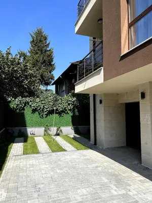 a building with a walkway in front of it at Atayana Apartment in Sofia