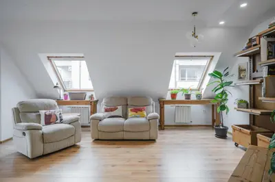 a living room with two chairs and a table at Charming & Cozy 2BD Apartment with Natural Light by Flat Mаnager in Sofia