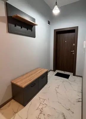 a room with a wooden bench and a door at Боко 16-18 in Sofia