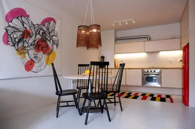 a kitchen with a table and chairs in a room at Host2U Art AP - Fireplace - Free parking - 5min Gondola in Bansko