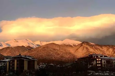 a view of a mountain range with snow covered mountains at Host2U Art AP - Fireplace - Free parking - 5min Gondola in Bansko