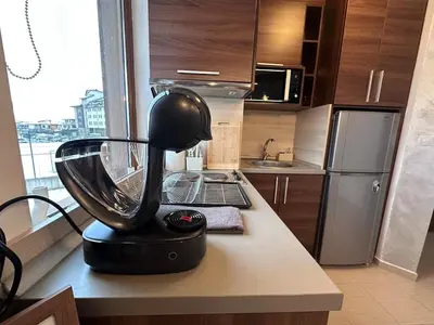a kitchen with a blender on a counter at Host2U Belvedere Apartment - Ski in - out - FREE Parking in Bansko