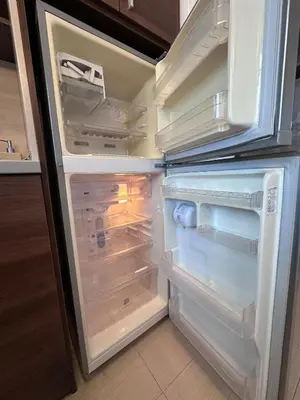 an empty refrigerator with its door open in a kitchen at Host2U Belvedere Apartment - Ski in - out - FREE Parking in Bansko