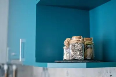 a jar filled with rocks sitting on a shelf at HD Comfort Apartment in Sofia