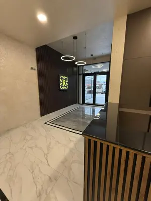 a lobby with a marble counter in a building at Pana Green Residence in Panagyurishte