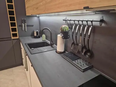 a kitchen counter with a sink and utensils at The View Sofia in Sofia