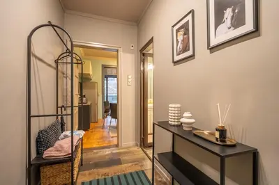 a living room with a table and a shelf at Stylish 2 BDRM Apt at NDK in Sofia