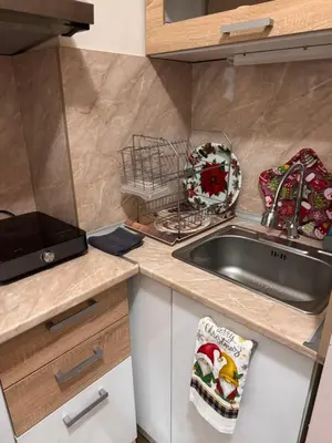 a kitchen with a sink and a counter top at Borovetz Gardens MVS Apart E28 in Borovets