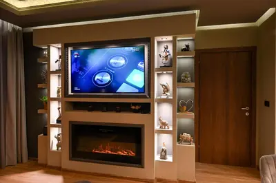 a living room with a tv and a fireplace at All Seasons Apartment in Sofia