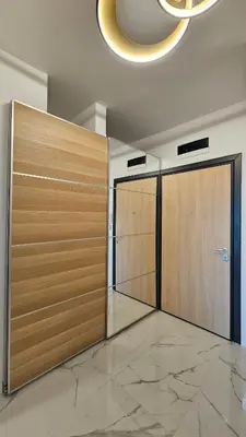 a hallway with two lockers in a building with at Cozy Urban Heaven with Dedicated Parking Spot in Sofia