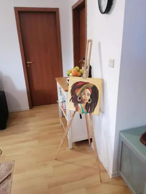 a painting of a girl on a easel at ИН Хоум Комфорт in Borovets