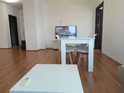 a white table and chairs in a living room at Two-bedroom Apartment Lauta 28 in Plovdiv