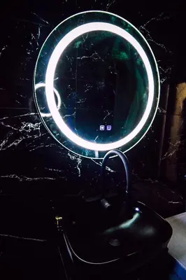 a round mirror with a green and white light at Апартамент Япония in Blagoevgrad