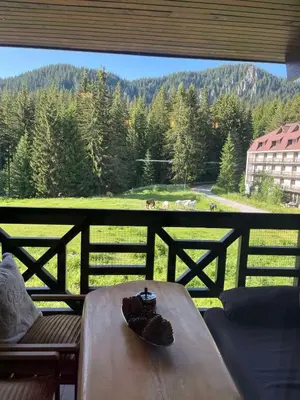 a table in front of a window with a view at From Sunrise to Sunset at Oak Residence Smolyan in Smolyan