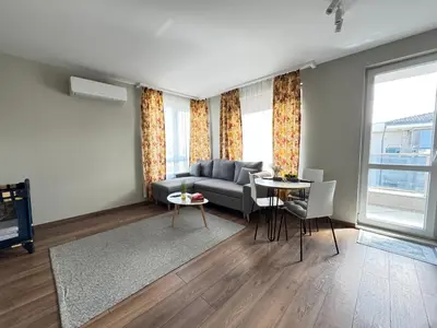 a living room with a couch and a table at Cozy place for nights in Plovdiv