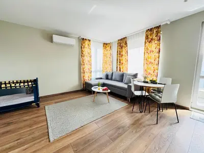 a living room with a couch and a table at Cozy place for nights in Plovdiv