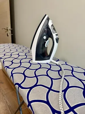 a computer monitor sitting on top of a bed at Cozy place for nights in Plovdiv