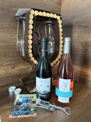 two bottles of wine sitting on top of a table at Cozy place for nights in Plovdiv