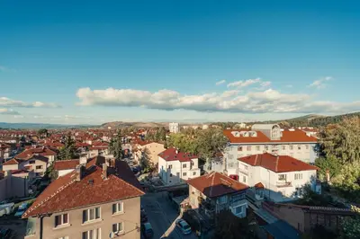 an aerial view of a city with buildings at Rila Family Haven in Samokov
