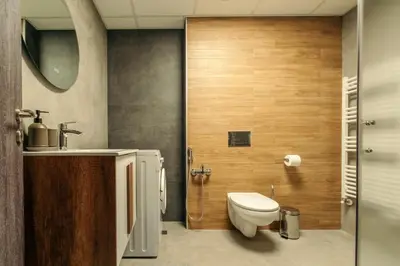a bathroom with a toilet and a sink at Rila Family Haven in Samokov
