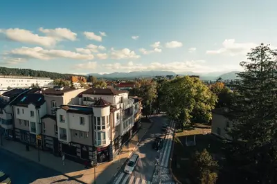 an aerial view of a city with buildings at Rila Family Haven in Samokov